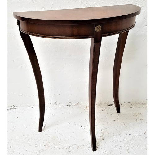 468 - REPRODUX MAHOGANY AND CROSSBANDED D SHAPE SIDE TABLE
standing on three sabre legs, 70cm high