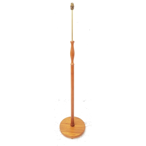 477 - TEAK STANDARD LAMP
raised on a circular base with a turned and shaped column with a brass column sec... 