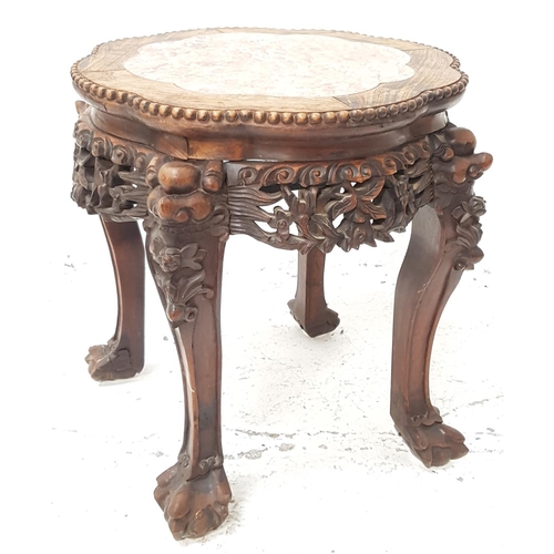 509 - CHINESE HARDWOOD JARDINERE STAND
with an inset red veined marble top above a carved frieze, standing... 