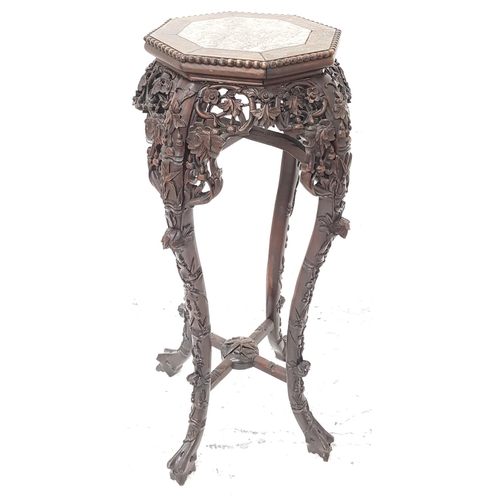 510 - CHINESE HARDWOOD JARDINERE STAND
with an octagonal inset red veined marble top above a carved frieze... 