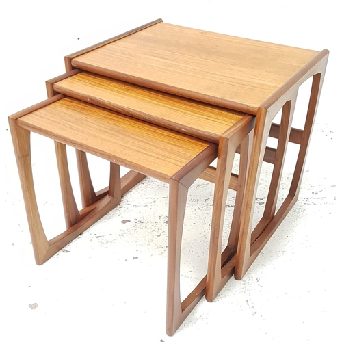 517 - NEST OF TEAK TABLES
standing on shaped continuous supports, 48cm high (3)