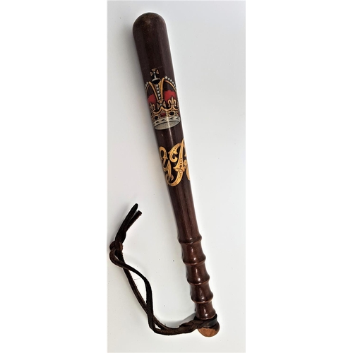 322 - GEORGIAN TRUNCHEON
with a polychrome cypher, the turned body with hand grip and leather wrist strap,... 