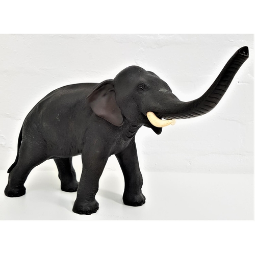 324 - JAPANESE BRONZE ELEPHANT
with naturalistic textured effect skin, with it's trunk raised with one tus... 