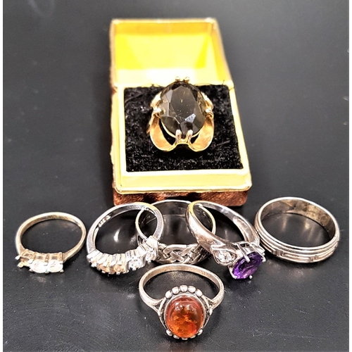 123 - SELECTION OF GOLD PLATED AND SILVER RINGS
comprising a smoky quartz dress ring on fourteen carat gol... 