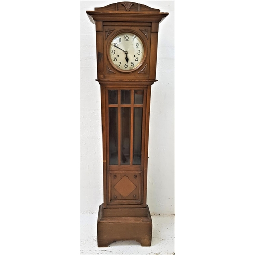 521 - OAK LONGCASE CLOCK
the circular silvered dial with Arabic numerals and Westminster chime movement, a... 