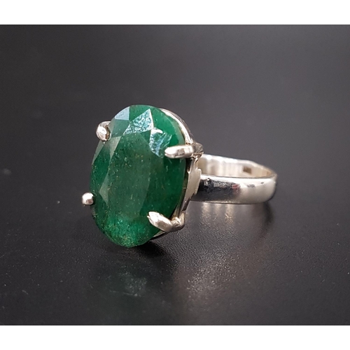 164 - EMERALD SINGLE STONE DRESS RING
the oval cut emerald approximately 10cts, on silver shank, ring size... 