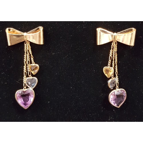 88 - UNUSUAL GEM SET NINE CARAT GOLD DROP EARRINGS
the graduated heart cut amethyst, aquamarine and citri... 