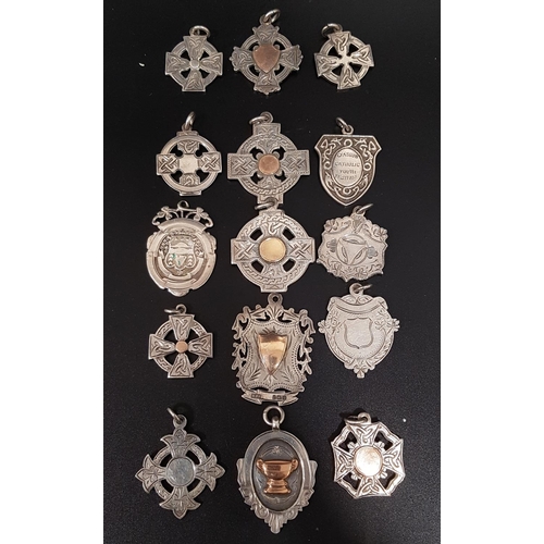 170 - SELECTION OF FIFTEEN SILVER MEDAL FOBS
of various designs, some with gold details, ten engraved to t... 