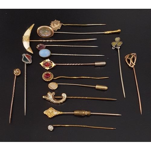 78 - SELECTION OF GOLD AND OTHER STICK PINS
including a double fox tooth example with gold mounts; a ten ... 