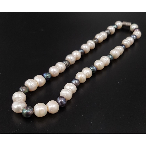 124 - BLACK AND WHITE FRESHWATER PEARL NECKLACE
with magnetic clasp, approximately 44cm long