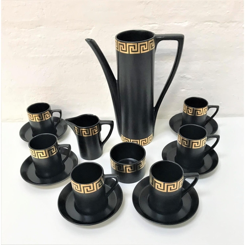 271 - PORTMEIRION COFFEE SET
decorated with a  black ground with a gold Greek key border, comprising coffe... 