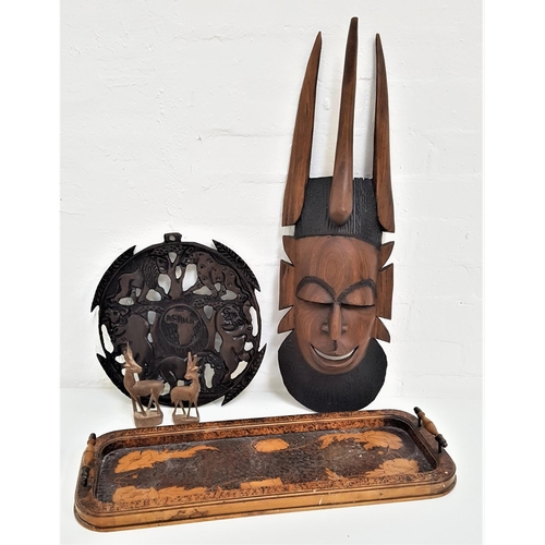 333 - AFRICAN CARVED TRIBAL MASK
of grotesque form, 67cm high, two carved African Impala, 16cm high, carve... 