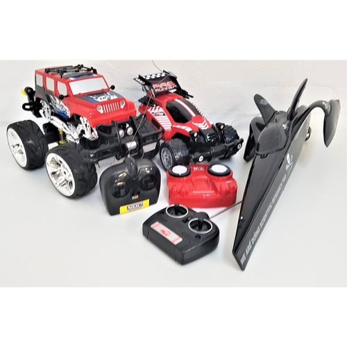 388 - THREE RADIO CONTROLLED VEHICLES
including a Nikko Fire Runner off road racer with hand held control ... 