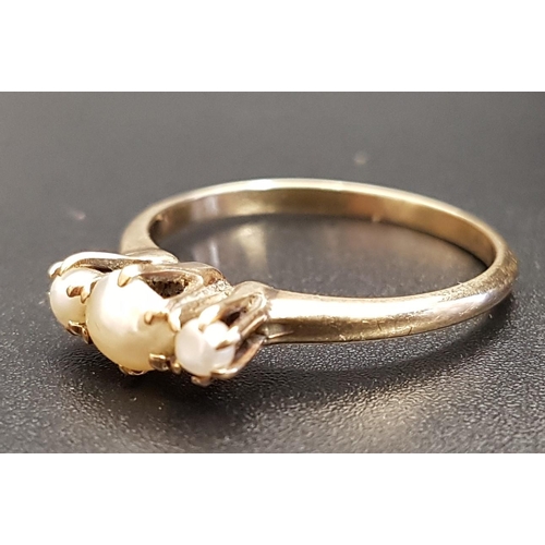 161 - GRADUATED PEARL THREE STONE RING
on fourteen carat gold shank, ring size O and approximately 2.2 gra... 