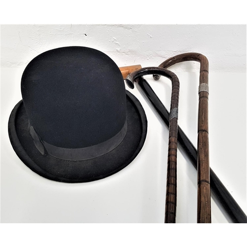 334 - BENNETS OF LONDON GENTS BOWLER HAT
with label, together with two walking canes with silver collars a... 