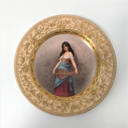 187 - ROYAL VIENNA CABINET PLATE
the centre hand painted with female musician holding a hurdy-gurdy, surro...