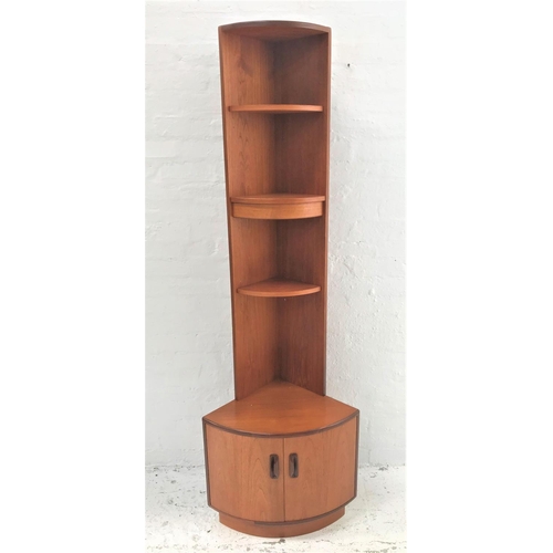 470 - G PLAN TEAK CORNER UNIT
with three open shelves above a base with a pair of cupboard doors, standing... 