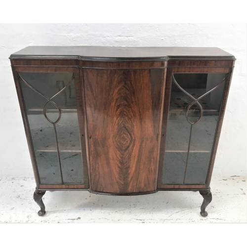 481 - MAHOGANY BOW FRONT DISPAY CABINET
with a moulded top above a central panelled door flanked by a pair... 