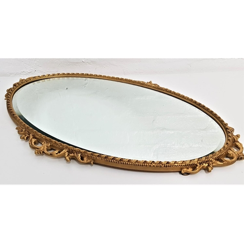 590 - PEER ART OVAL WALL MIRROR
with a bevelled plate and gilt frame, 74.5cm high