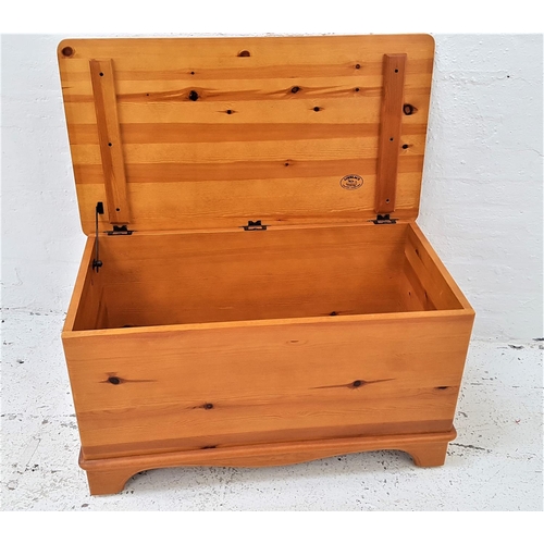 591 - LOVELACE PINE BLANKET BOX
with a lift up lid, side carrying handles, on wheels, 91cm wide