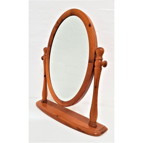 592 - LOVELACE PINE DRESSING TABLE MIRROR
with an oval bevelled plate, on a shaped stand, 64cm high