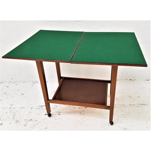 593 - EASTCRAFT MAHOGANY FOLDOVER GAMES TABLE
with a baize lined swivel top, standing on tapering supports... 