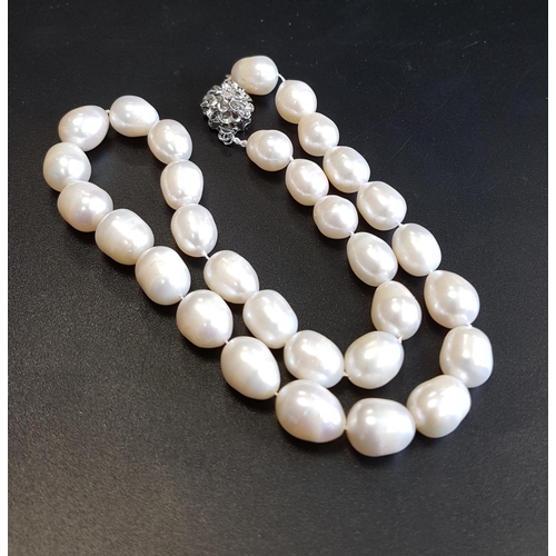 87 - FRESHWATER PEARL NECKLACE
all individually knotted and with flower design clasp, approximately 44cm ... 