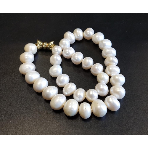 108 - LARGE FRESHWATER PEARL NECKLACE
with nine carat gold bow shaped clasp, approximately 45cm long