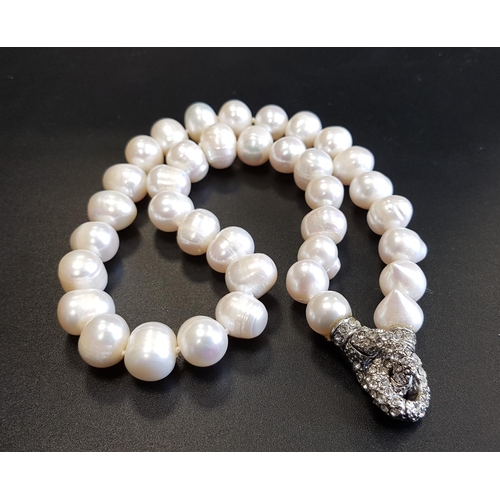 64 - FRESHWATER PEARL NECKLACE
with unusual rhinestone set clasp, 46cm long