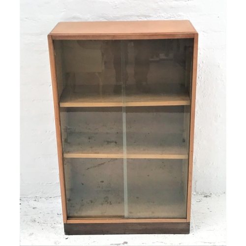 504 - OAK BOOKCASE
with a rectangular moulded top above a pair of sliding glass doors with two adjustable ... 