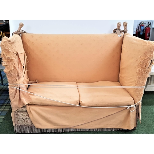 529 - KNOLL TWO SEAT SOFA
covered in a floral green and brown material with a fitted yellow loose cover ov... 