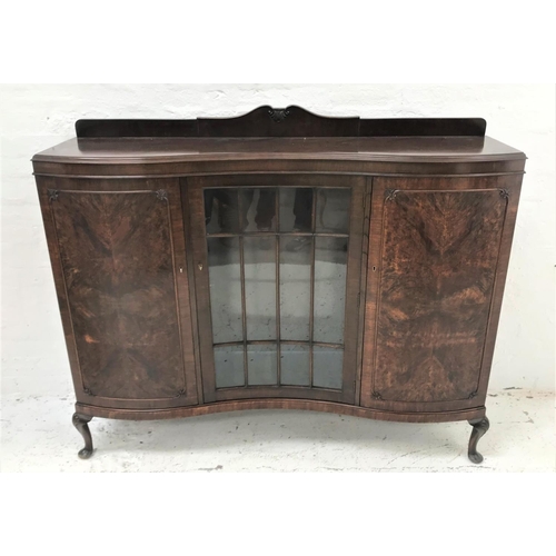 531 - MAHOGANY SERPENTINE FRONTED DISPLAY CABINET
with a shaped raised back above a moulded top with a cen... 