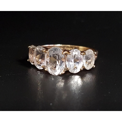 16 - GRADUATED QUARTZ FIVE STONE RING
the oval cut quartz gemstones on ten carat gold shank, ring size P