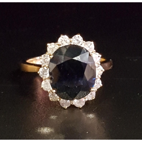 95 - SAPPHIRE AND DIAMOND CLUSTER RING
the large central oval cut sapphire approximately 4.65cts, in four... 
