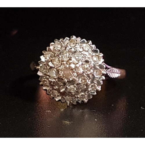 120 - DIAMOND CLUSTER RING
the multi diamonds tn circular stepped setting, on eighteen carat gold shank, r... 
