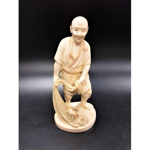 305 - JAPANESE IVORY OKIMONO OF A FISHERMAN
Meiji period, holding a net with a crab crawling up it, signed... 