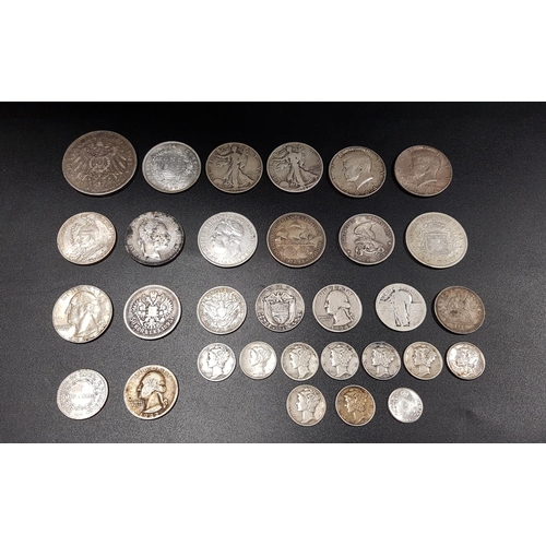 446 - SELECTION OF SILVER WORLD COINS
all .900 silver content, including two USA 1964 half dollars, a USA ... 
