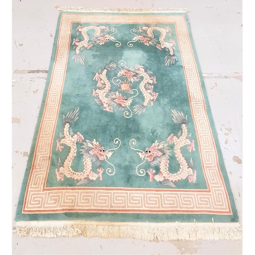 488 - CHINESE WASH RUG
with a green ground decorated with dragons and a Greek key border, 282cm x 186cm