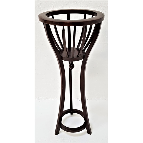 506 - MAHOGANY JARDINERE STAND
the circular tapering bowl top with slatted sides, standing on shaped suppo... 