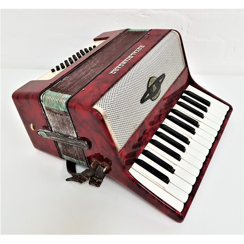 385 - ROYAL STANDARD ACCORDIAN
with a mottled red body and shoulder straps