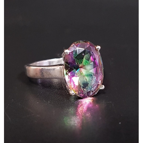 7 - MYSTIC TOPAZ SINGLE STONE RING
the oval cut topaz approximately 5.5cts, on silver shank, ring size P