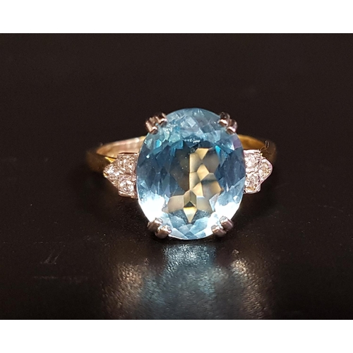 72 - BLUE TOPAZ AND DIAMOND RING
the central oval cut topaz approximately 4.2cts, flanked by three small ... 