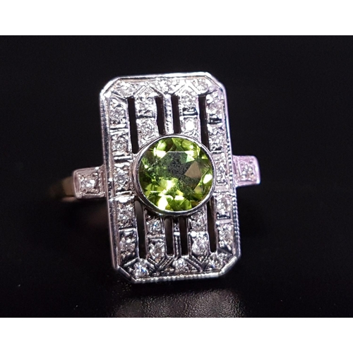 100 - ART DECO STYLE PERIDOT AND DIAMOND PLAQUE RING
the central round cut peridot approximately 1ct in pi... 