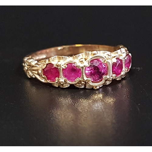 148 - GRADUATED RUBY FIVE STONE RING
the central ruby approximately 0.3cts, in scroll decorated setting an... 
