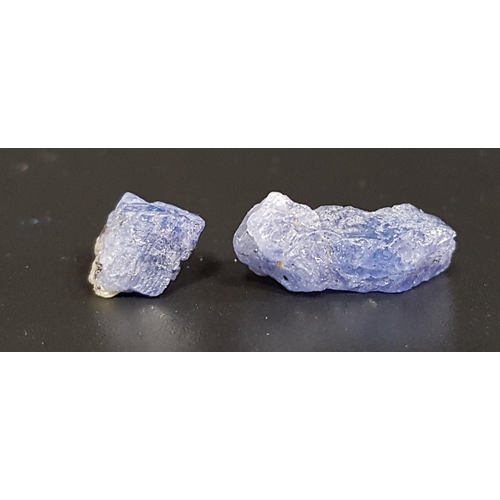 149 - TWO CERTIFIED LOOSE ROUGH UNCUT NATURAL TANZANITES
weiging 4.70 and 2.54cts respectively, both with ... 