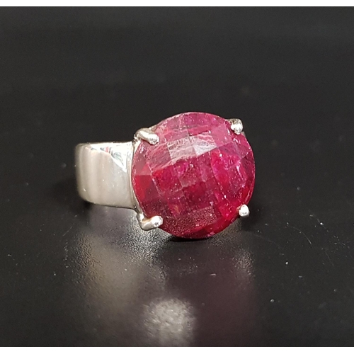 153 - RUBY SET SINGLE STONE RING 
the checkerboard faceted cabochon ruby on silver shank, ring size Q-R