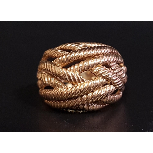 1 - NINE CARAT GOLD BOMBE STYLE RING
with entwined rope twist strands, ring size O-P and approximately 6... 