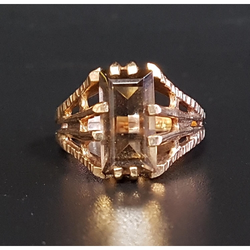 26 - SMOKY QUARTZ SINGLE STONE RING
the step cut quartz on nine carat gold shank, with textured and split... 