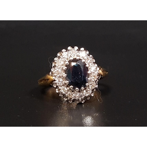 36 - SAPPHIRE AND DIAMOND CLUSTER RING
the central oval cut sapphire weighing approximately 1.13cts, in f... 
