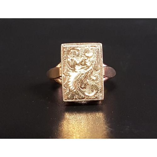 43 - UNUSUAL NINE CARAT GOLD LOCKET RING
the rectangular locket section with hinged scroll engraved cover... 
